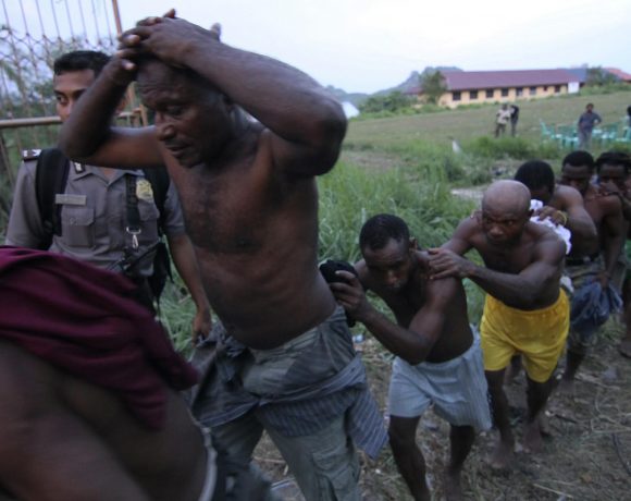 Indonesian police arrest attendees of the Third Papuan People Congress in Abepura. October 2011. 